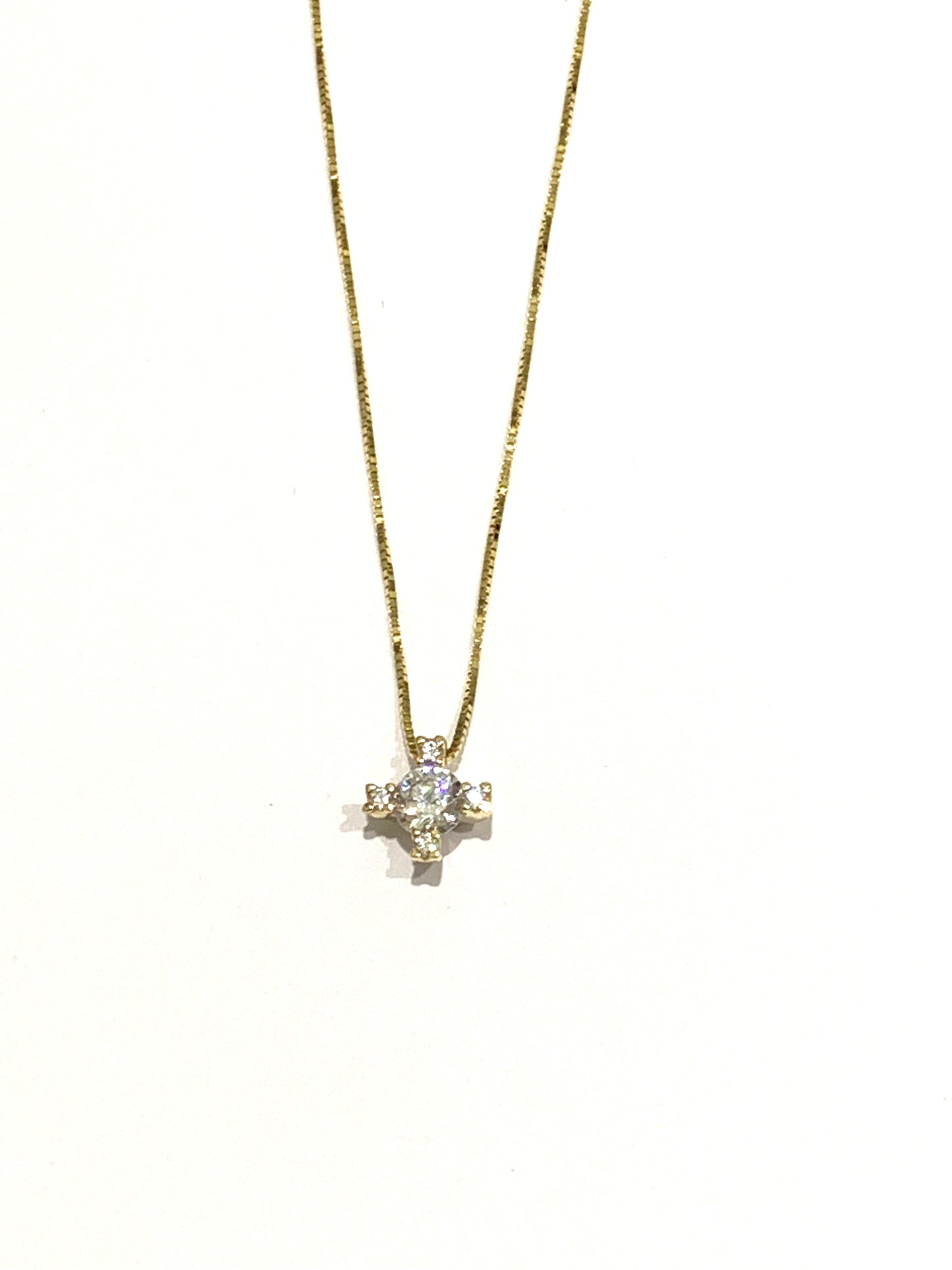 Collana oro bianco/giallo 18kt con punto luce a quattro griffes