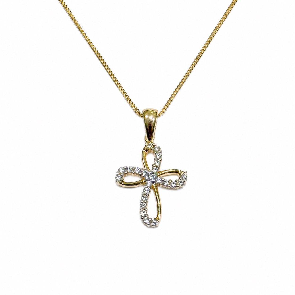 Collana oro giallo 9kt con croce sagomata ricoperta da piccoli zirconi bianchi.