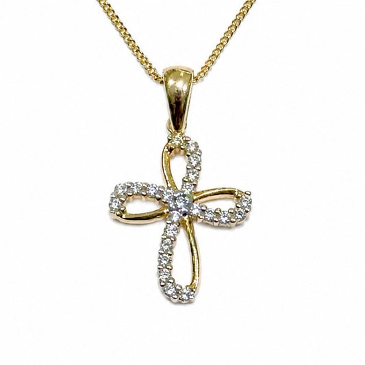 Collana oro giallo 9kt con croce sagomata ricoperta da piccoli zirconi bianchi.