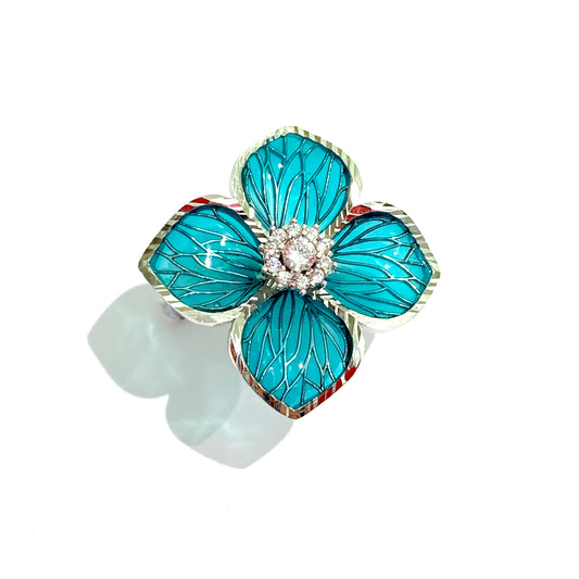 Anello in argento con fiore turchese e zirconi bianchi nella parte centrale. Dimensioni fiore 2,7 cm. Misura regolabile da 10 a 15.