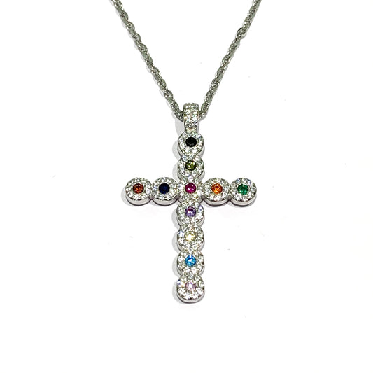 Collana in argento con croce ricoperta da zirconi colorati e bianchi. Lunghezza catena 44 cm. Dimensioni ciondolo 3x2 cm. Spedizione gratuita con confezione regalo.