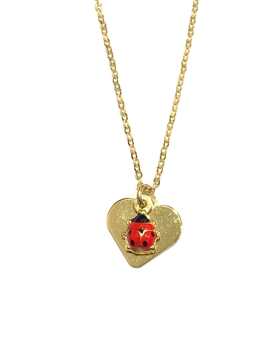 Collana oro giallo 9kt con coccinella e cuore/farfalla