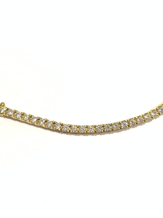 Bracciale tennis in oro giallo 18kt con zirconi. Lunghezza 19,5 cm. Dimensione zirconi 0,2 cm.