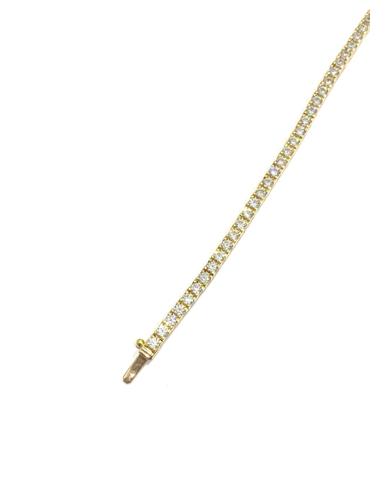 Bracciale tennis in oro giallo 18kt con zirconi. Lunghezza 19,5 cm. Dimensione zirconi 0,2 cm.