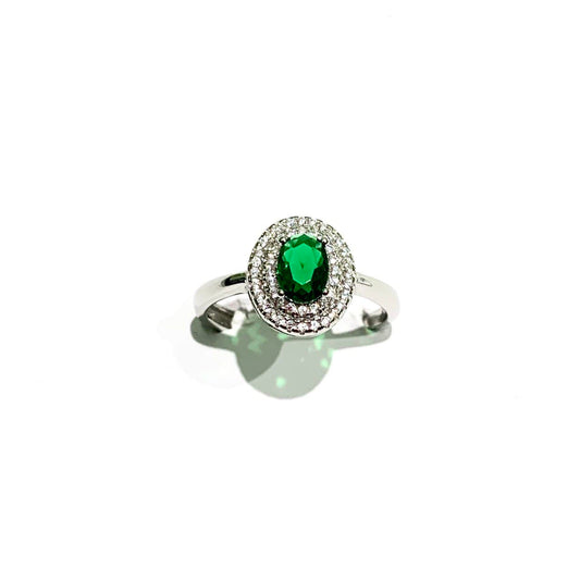 Anello in argento con zircone ovale colorato circondato da due giri di zirconi bianchi.

Disponibile in più colori.

Misure regolabili in ogni anello.

 